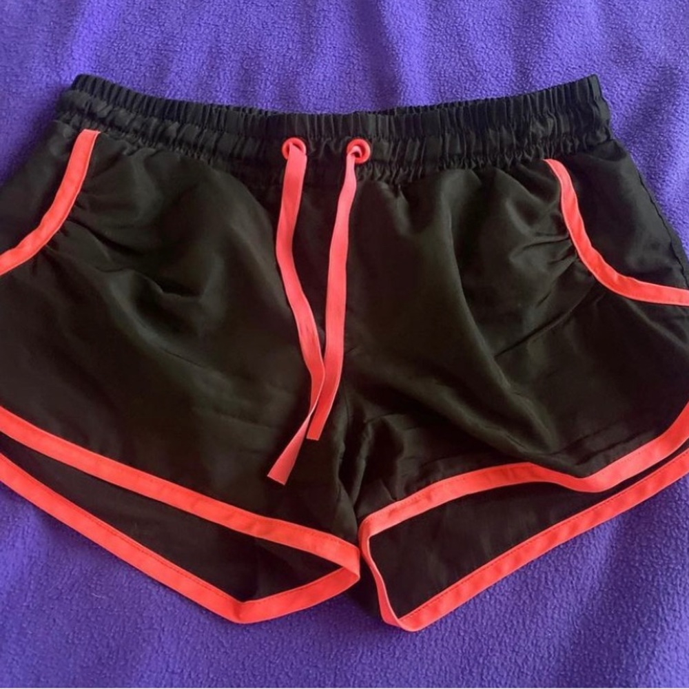 Black and pink athletic shorts